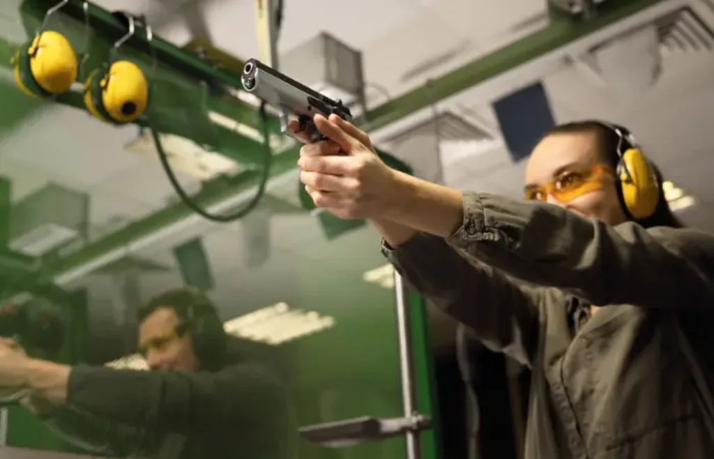 Woman shooting a gun
