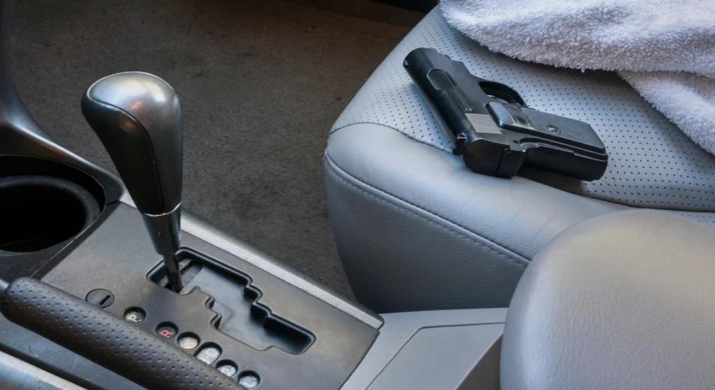 handgun on car seat
