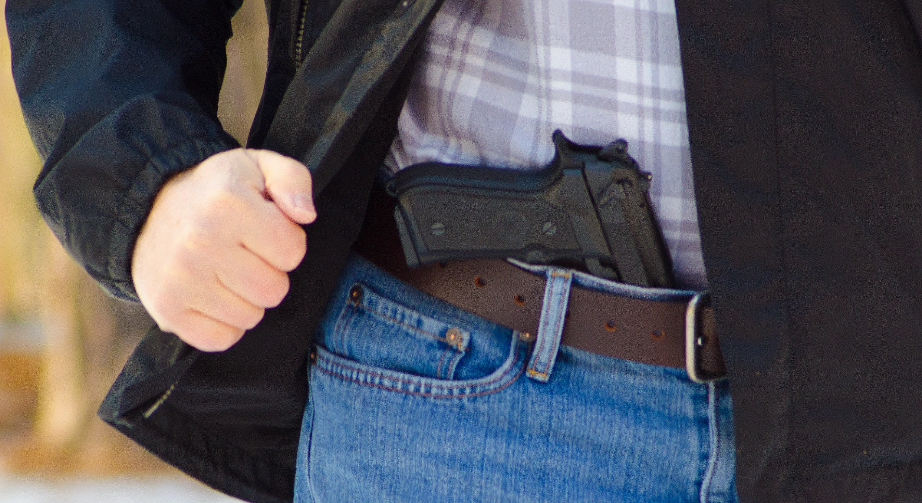 Man with Beretta in his pants