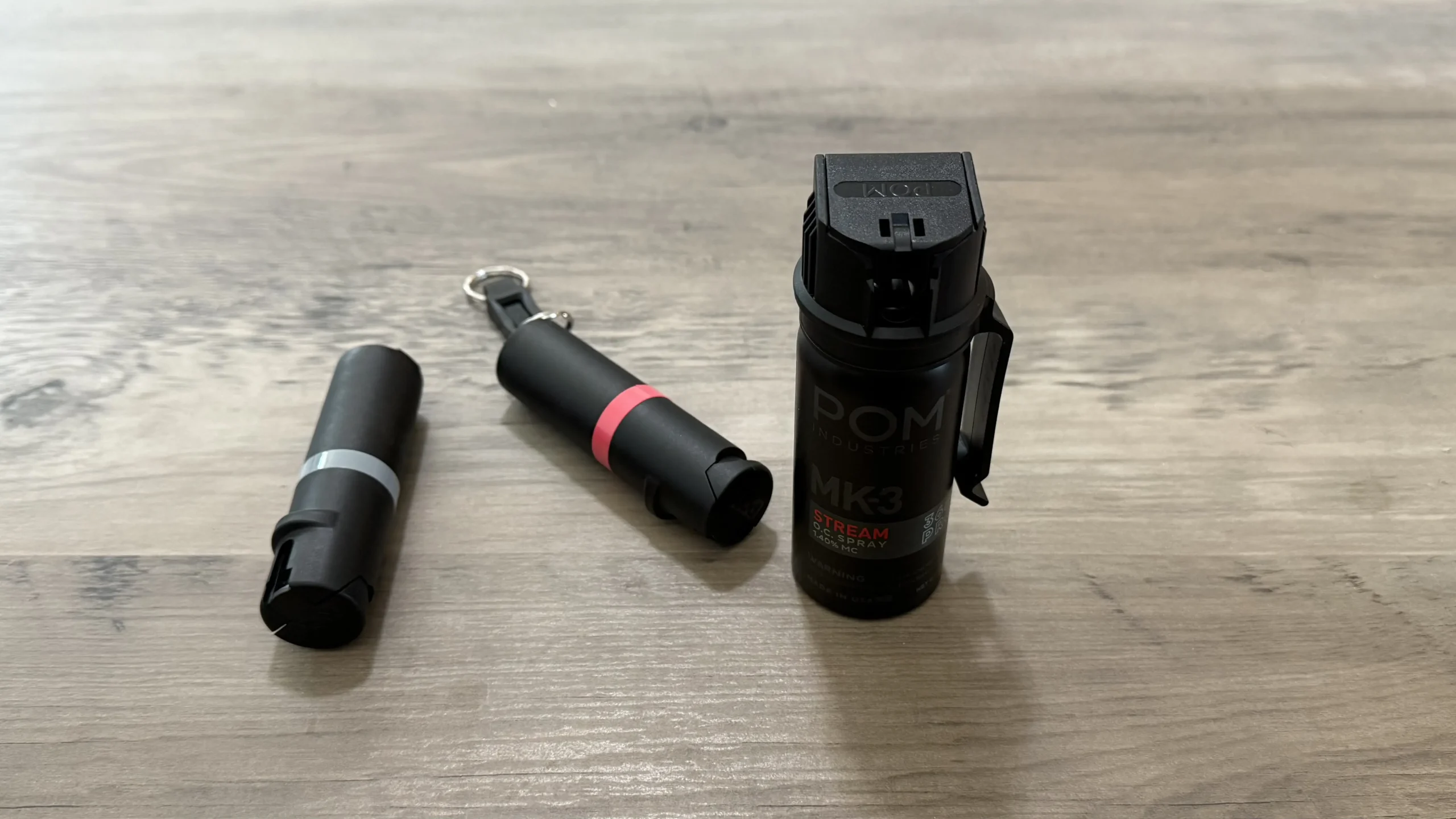 from left to right: POM Industries Pocket Clip, Keychain, & Mk3