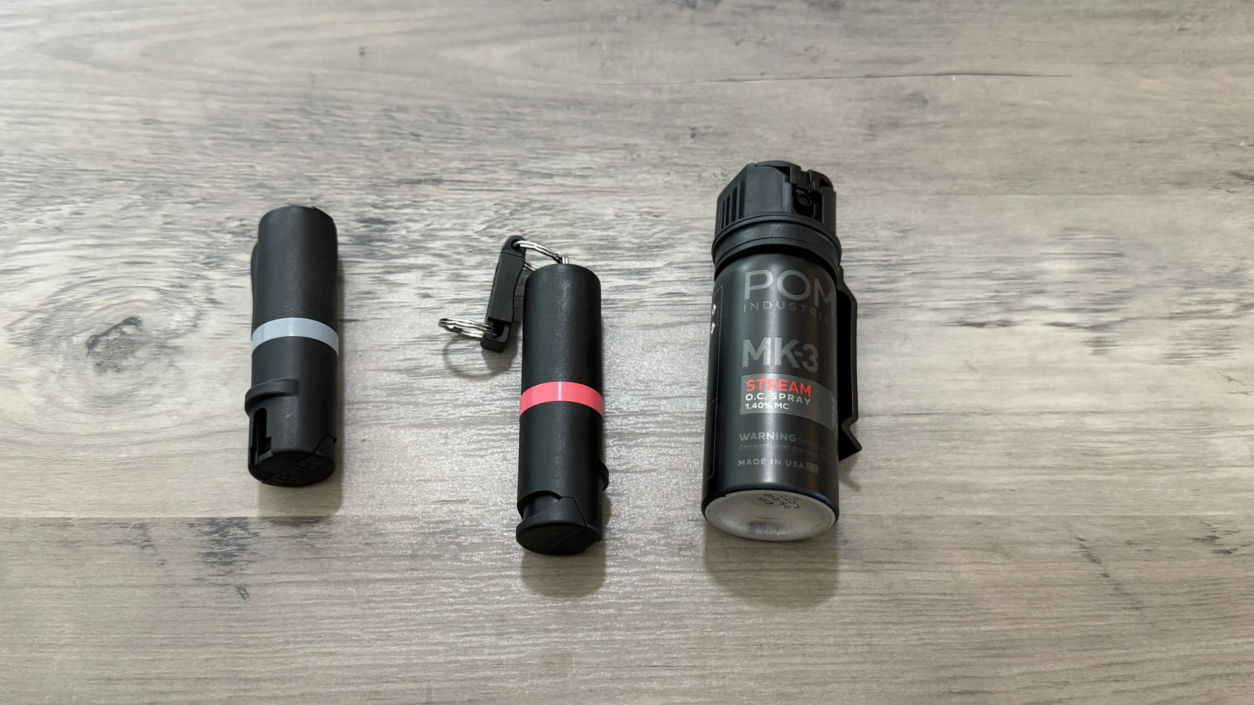 From left to right: POM Industries Pocket clip, Keychain & MK3