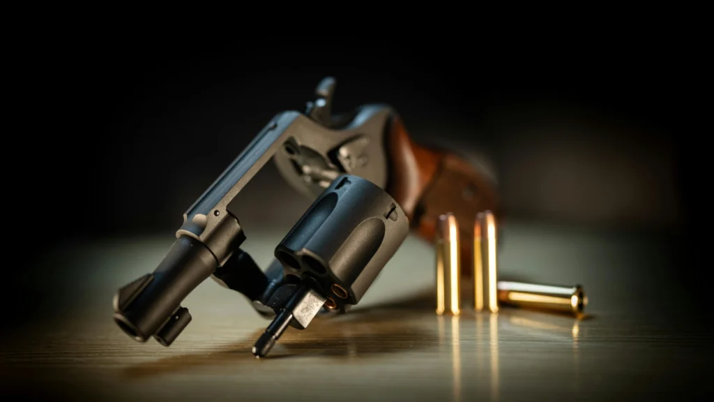 Revolver with bullets on a table