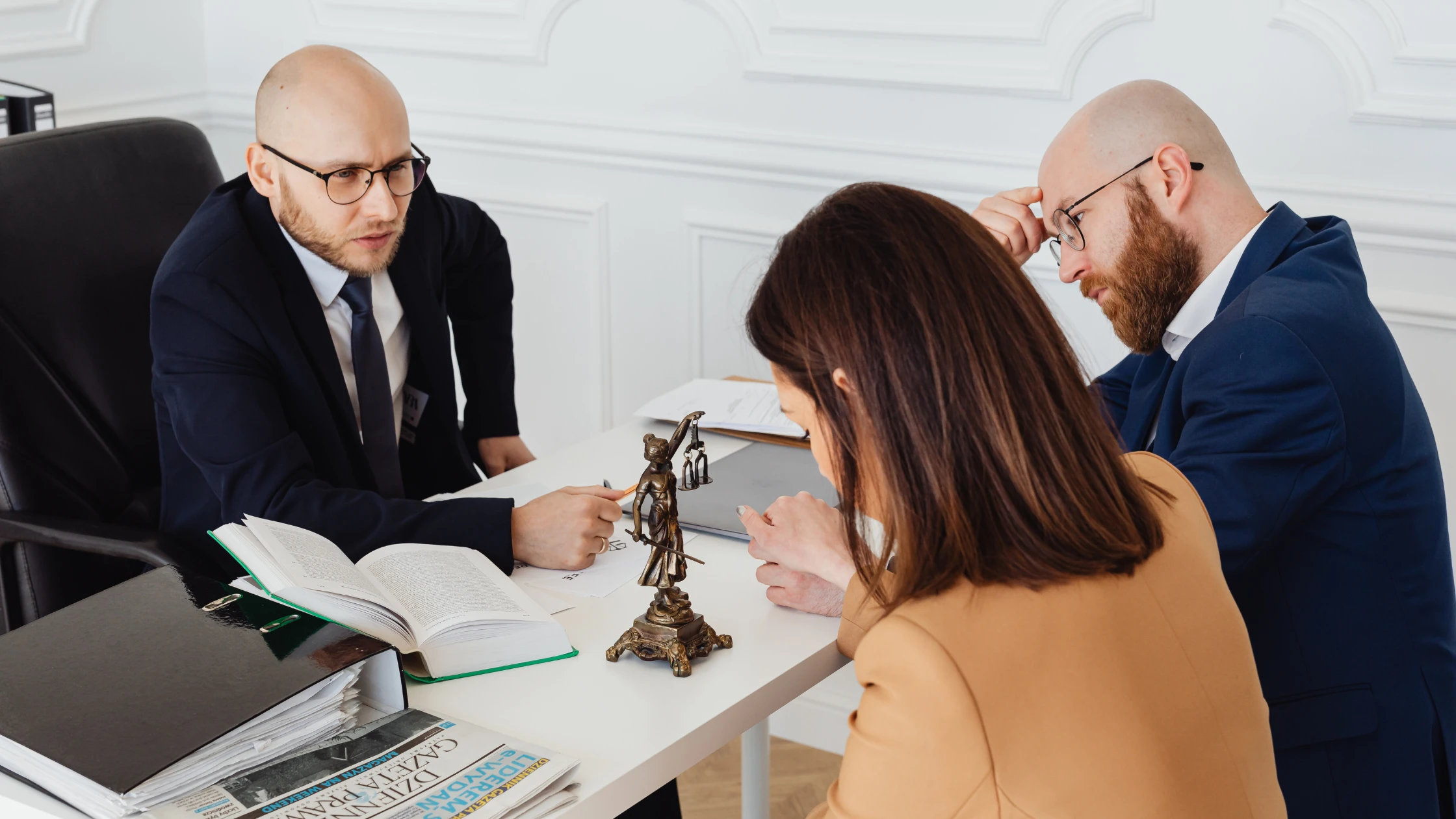 husband and wife talking with an attorney